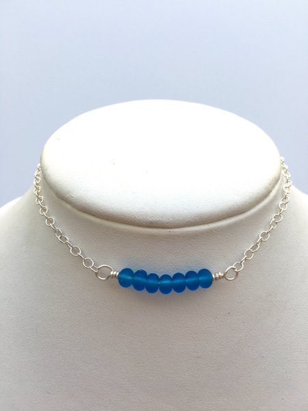 Ocean blue glass beads wire wrapped onto a sterling silver anklet