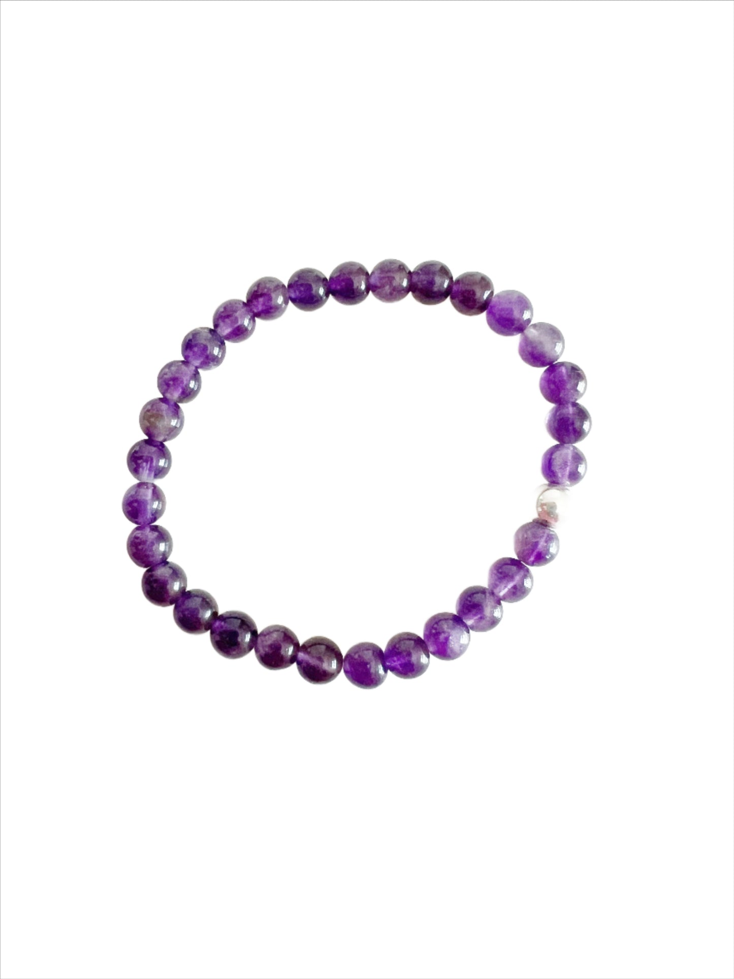 Amethyst stretch bracelet with one sterling silver bead on a white background.