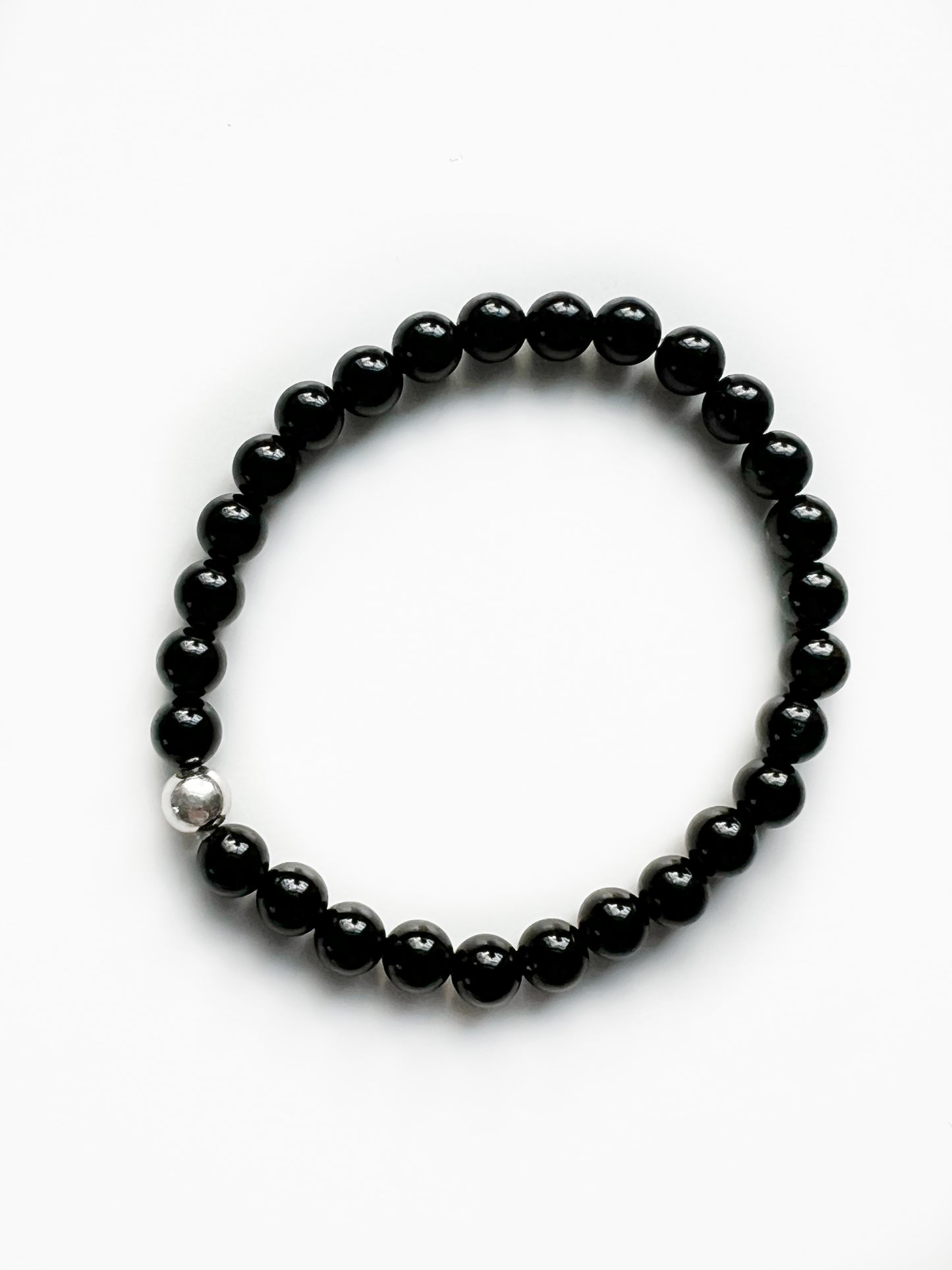 Simple everyday black onyx stretch bracelet with one sterling silver bead