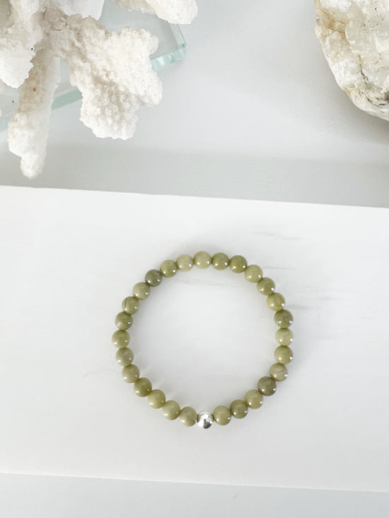 Simple modern everyday avocado jasper stretch bracelet with one sterling silver bead